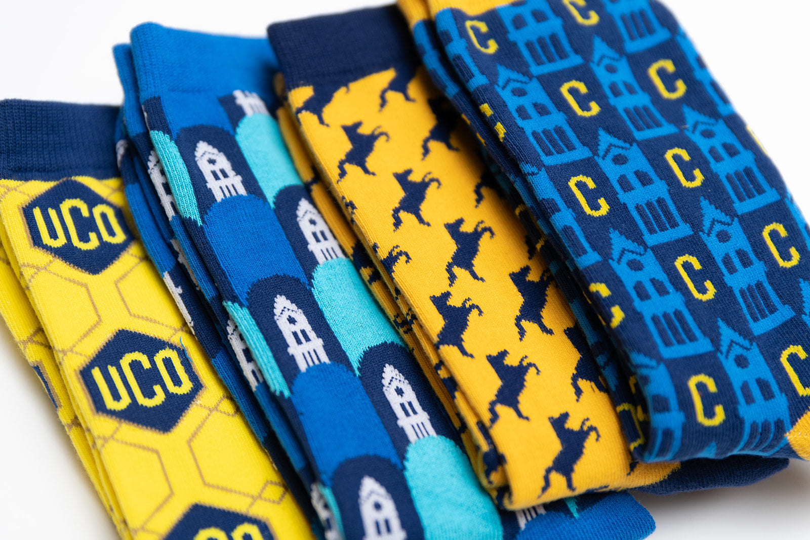 4 UCO socks laid on top of each other